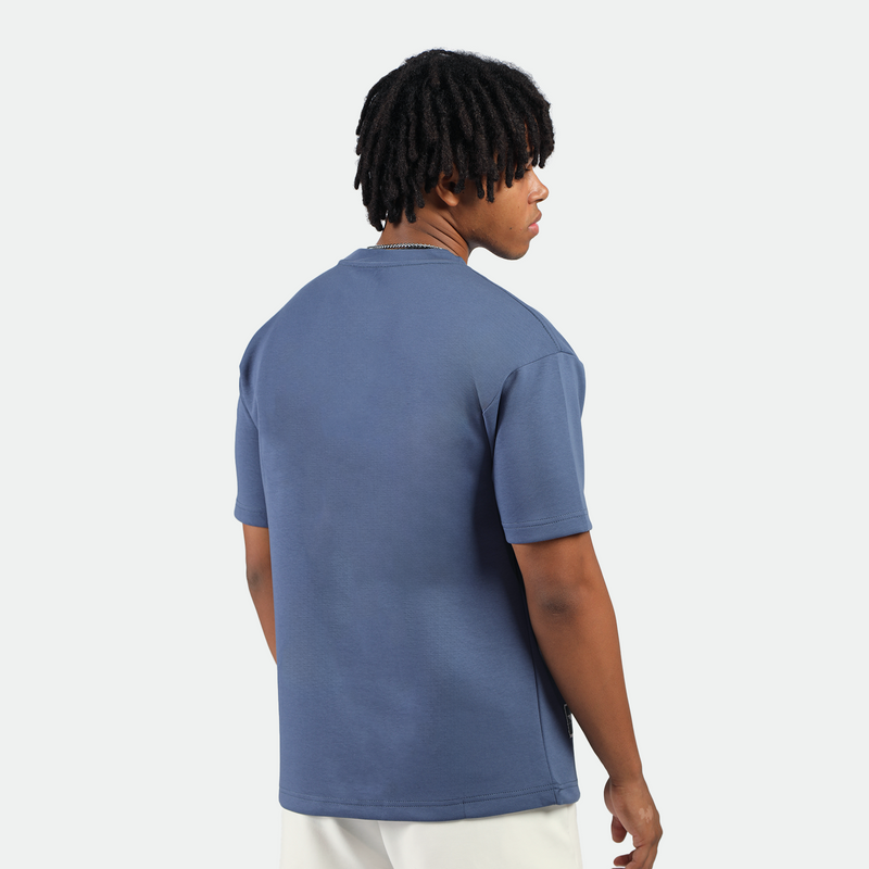 a back view for fit man wearing t-shirt indigo blue with short white 