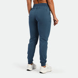 a back view for fit man wearing  jogger pants blue 