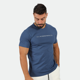 a fit man wearing t-shirt blue opal with logo and short white 