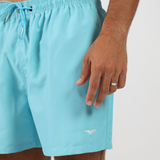 close up view for fit man wearing short blue with logo 