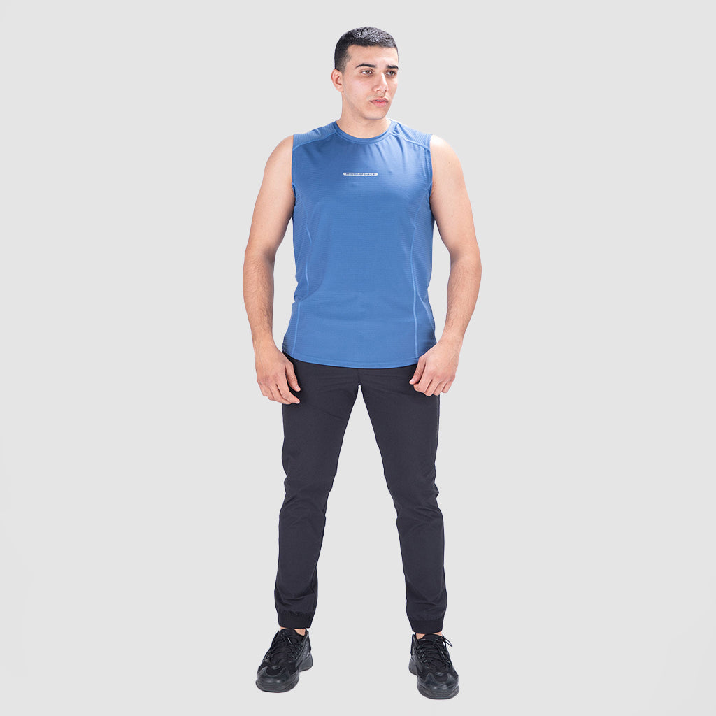 a fit man wearing  t-shirt blue  with pants black ,plus the shoes 