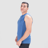 a fit man stand at right and wearing tank blue with pants black 