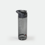 Clear plastic water bottle with gray flip cap and measurement markings in milliliters and ounces. Sleek and modern design on a white background.