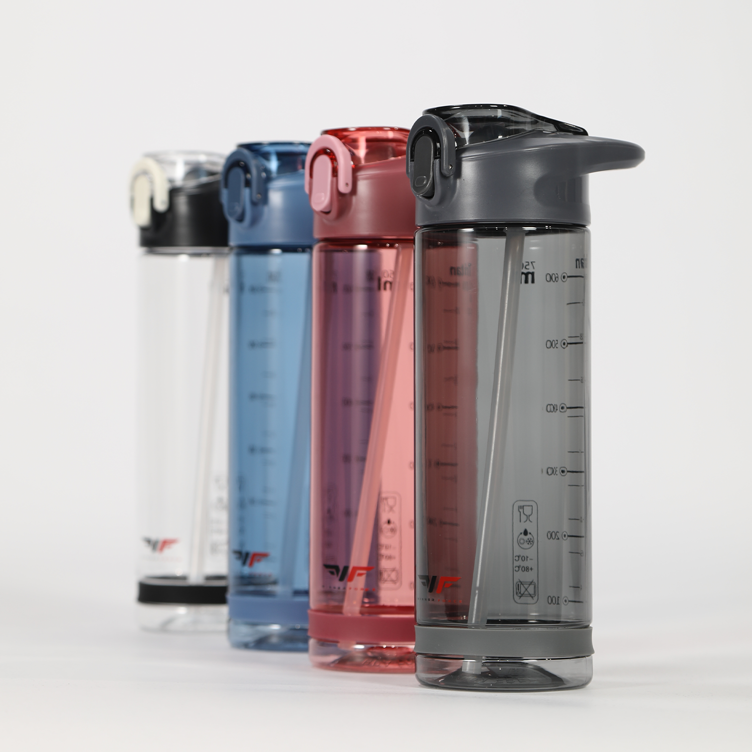 Four water bottles in a row, each with a flip-top lid and measurement markings. Colors are clear, blue, pink, and gray on a white background.