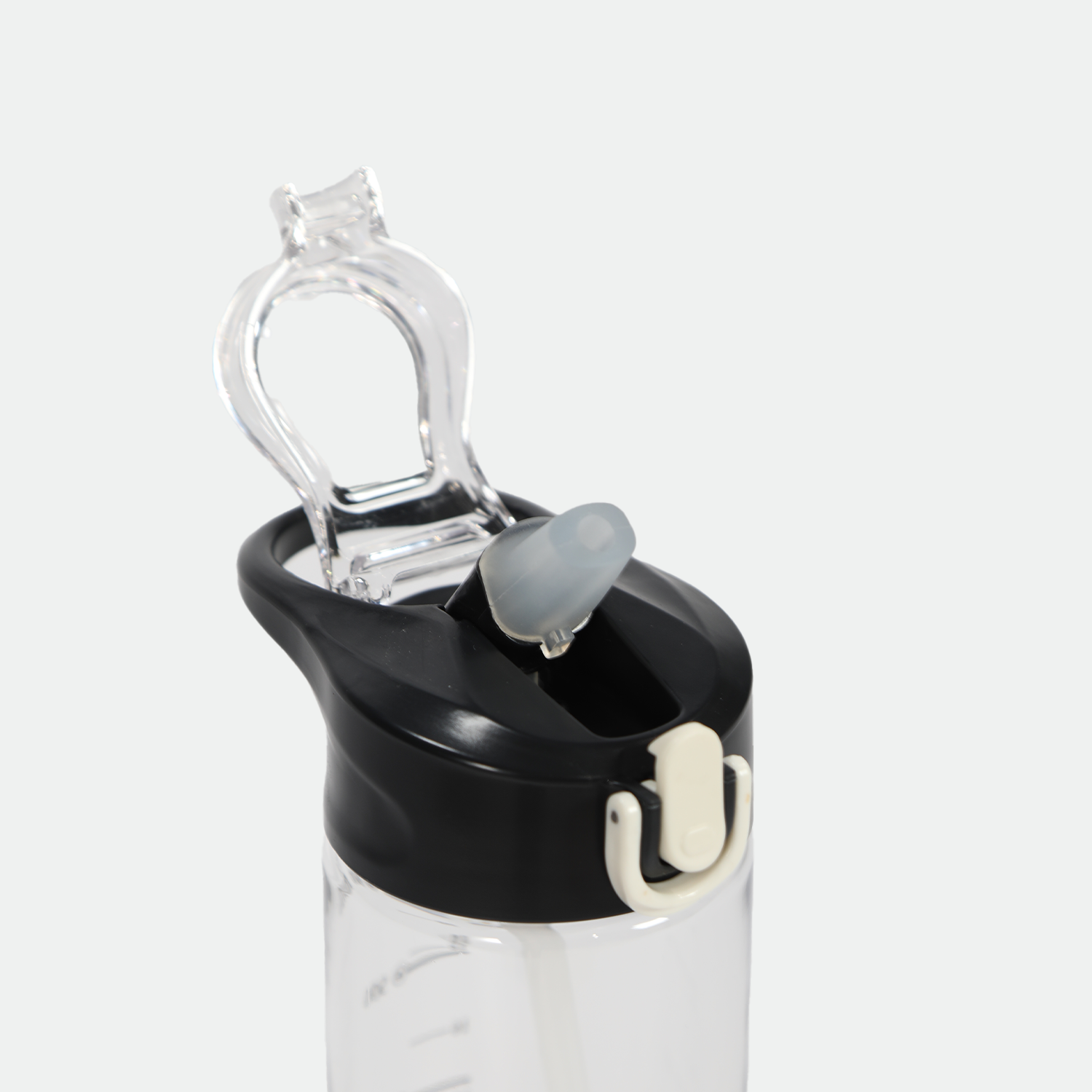 Clear water bottle with a black lid, featuring a flip-top spout and a transparent carrying loop. The design appears modern and functional.
