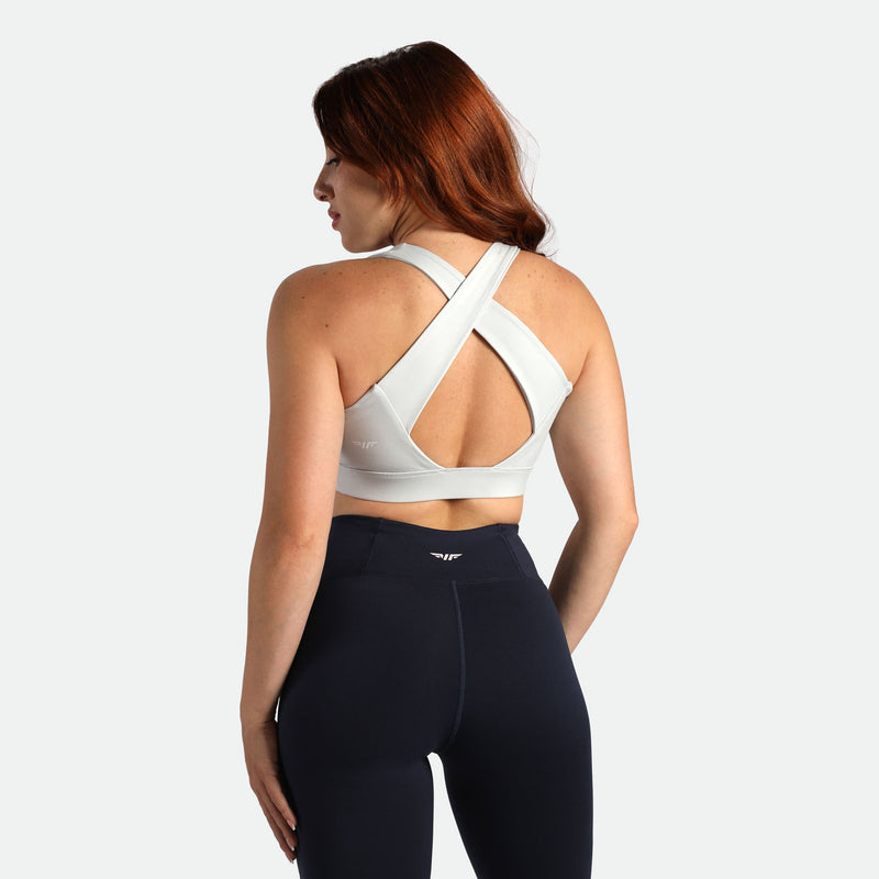  a back view for fit woman wearing bra grey and legging black 