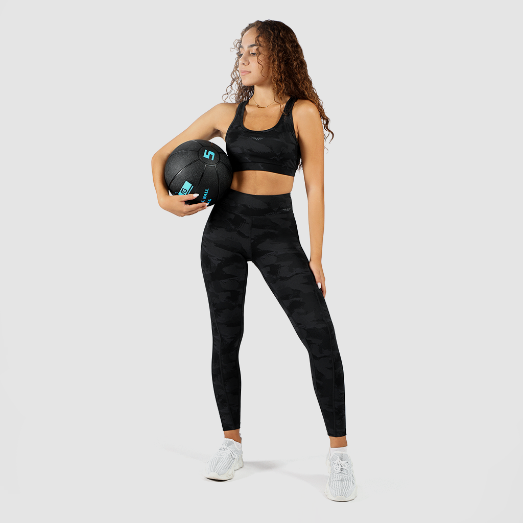 a women wearing  matching   camo bra and legging ,plus logo