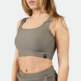 close up view for a fit woman  wearing bra olive grey 