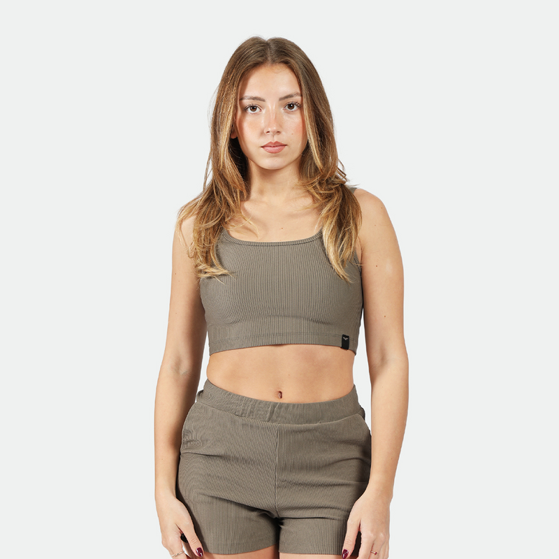 a fit woman wearing matching set  olive grey  bra and short 