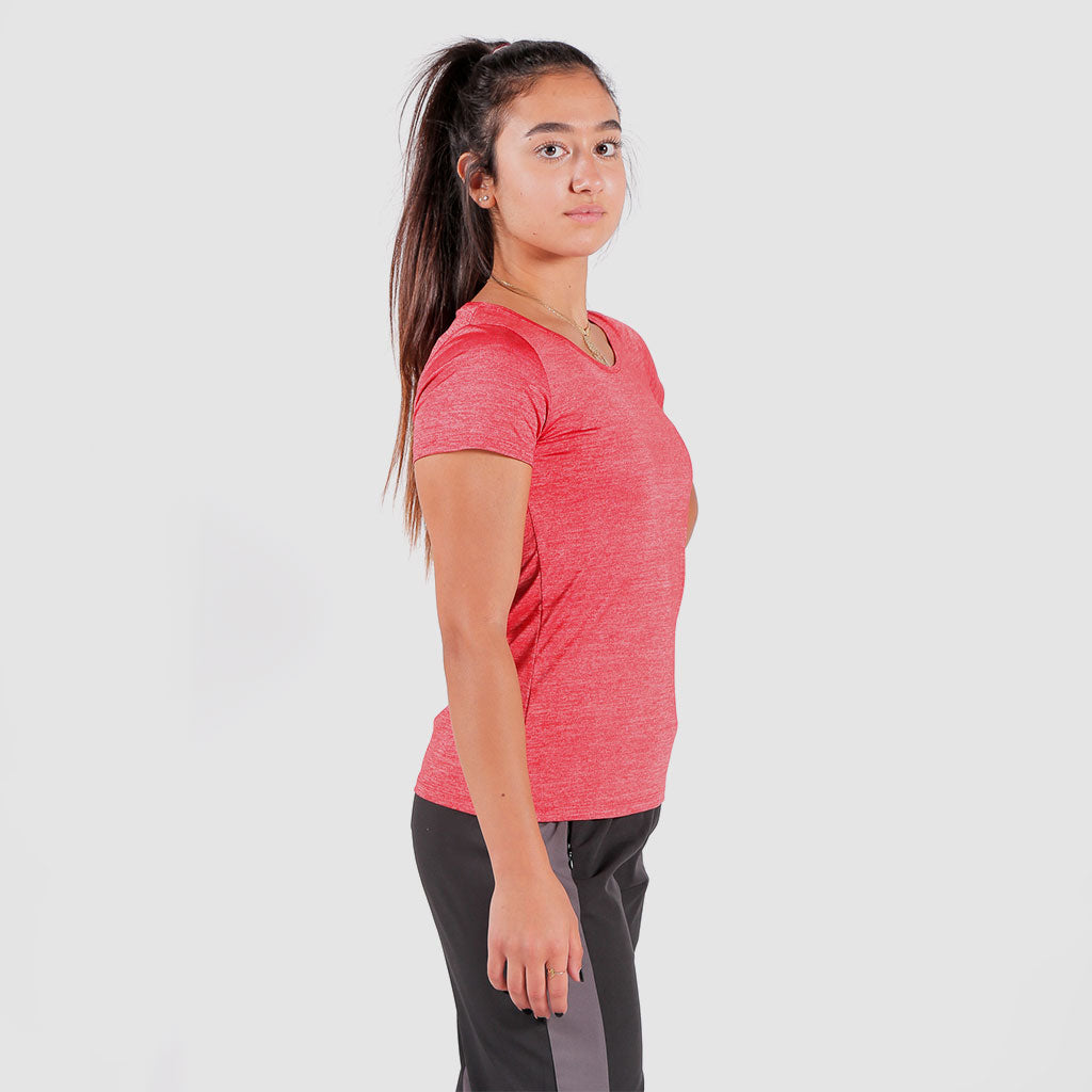 a fit woman stand at right and wearing candy red t-shirt with pants 