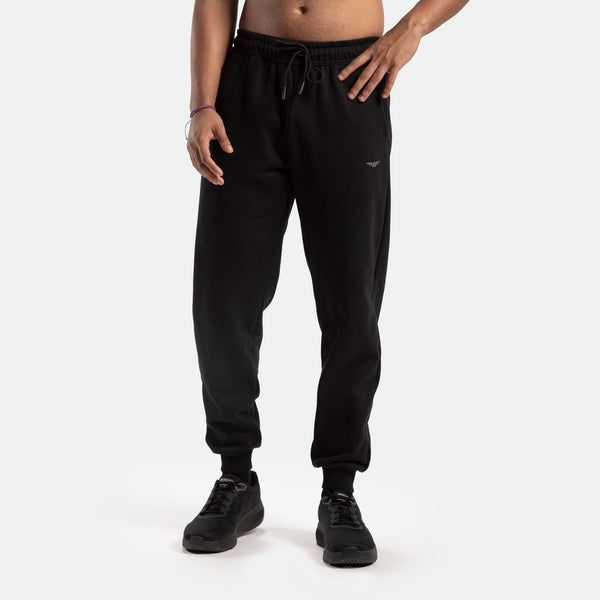 a fit man wearing jogger pants black with logo ,plus the shoes black 