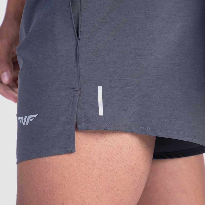 close up view view for fit man wearing short grey with logo 