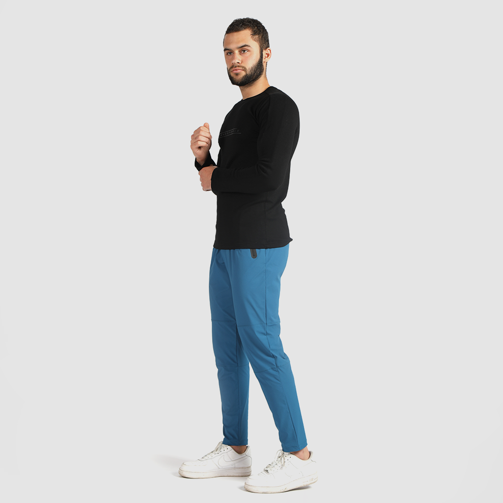 a fit man wearing t-shirt  black with pants  classic blue ,plus the shoes white