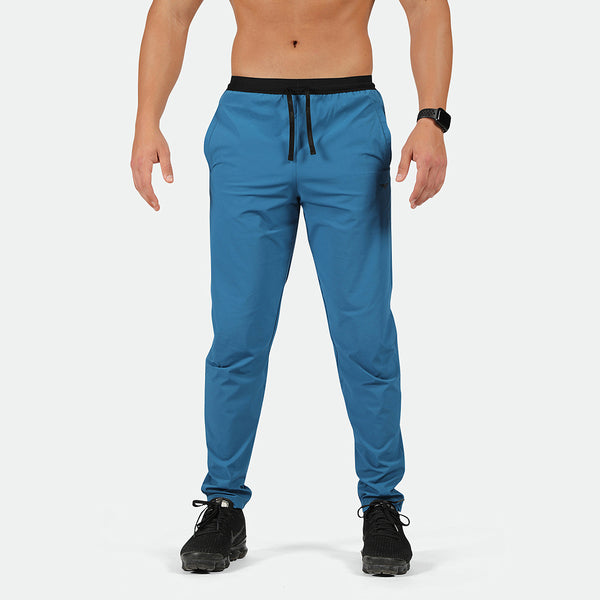 a fit  man wearing pants classic blue  with shoes black 