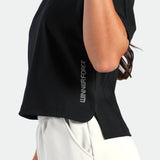 Person wearing a black sleeveless top with 'Winner Force' branding on a white background