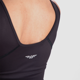 close up view for fit woman wearing crop top black with logo 