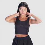 a fit woman  wearing crop top black  with short black 