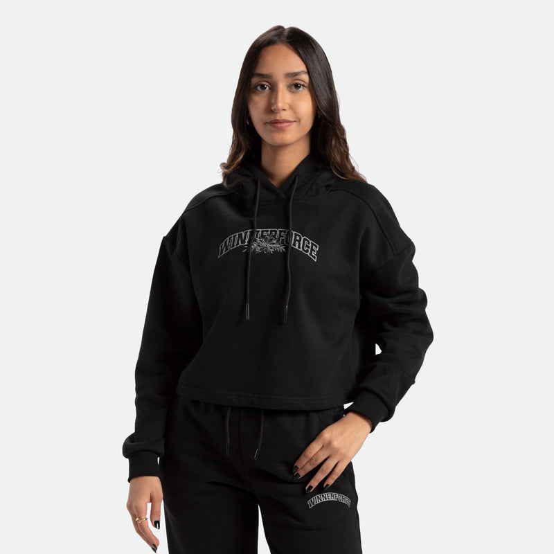 a fit woman wearing matching set black  with logo  hoodie and pants 