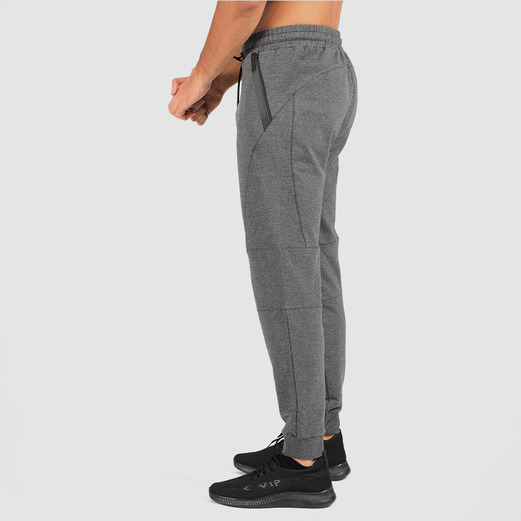 a fit man stand at right and wearing pants marl light grey with shoes black 