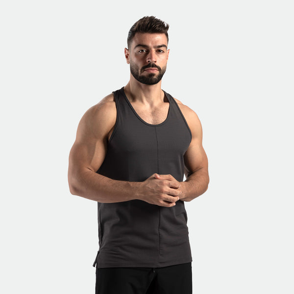 a fit man wearing t-shirt  dark grey with pants black 