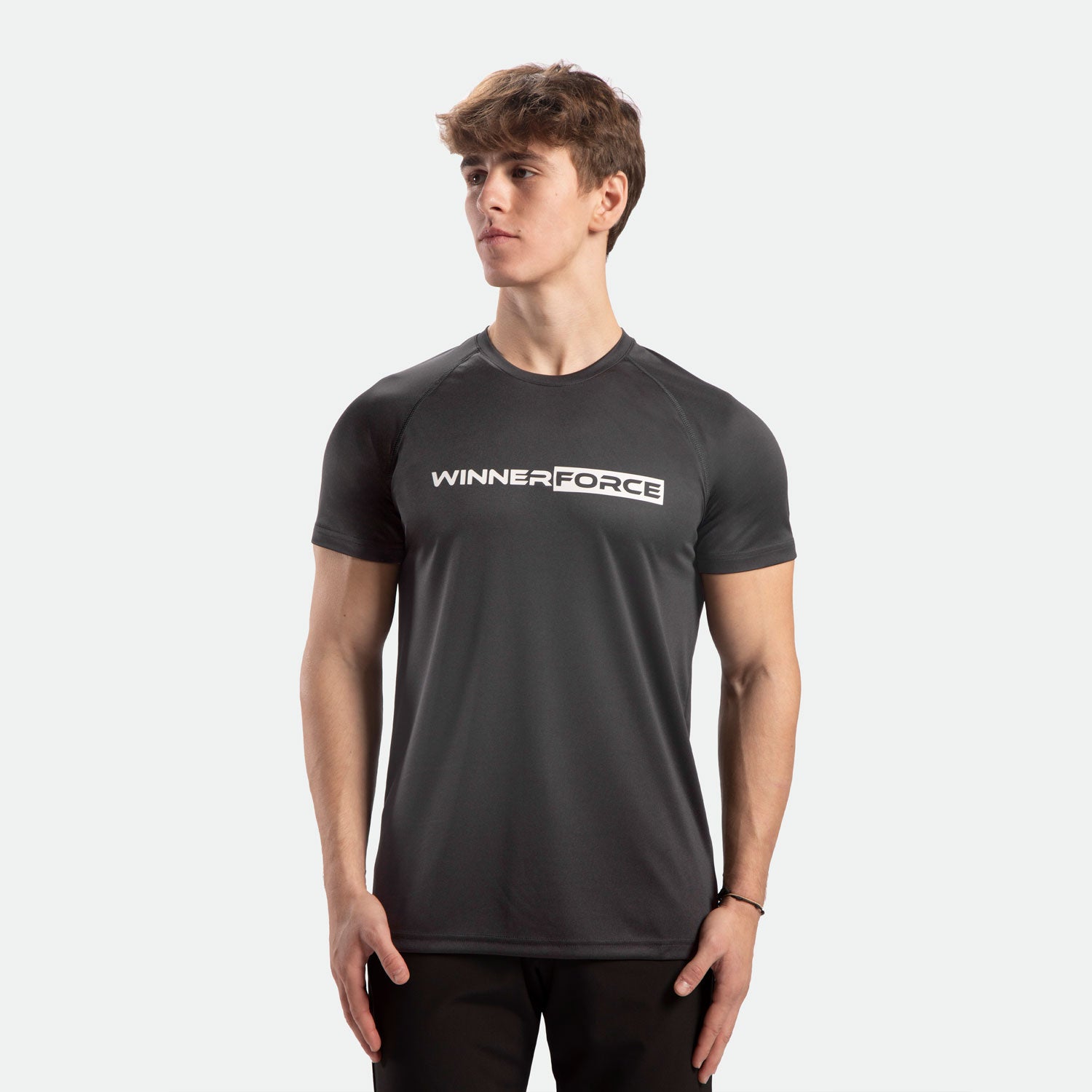 a fit man wearing t-shirt dark  grey with pants black 
