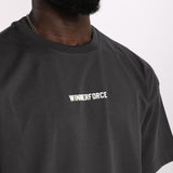 close up view for fit man wearing t-shirt dark grey with logo 