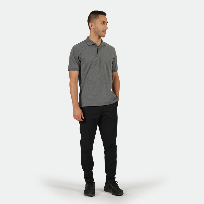 a fit man wearing t-shirt dark grey with pants black ,plus shoes black 