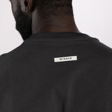 close up view for fit man wearing t-shirt dark grey  with logo