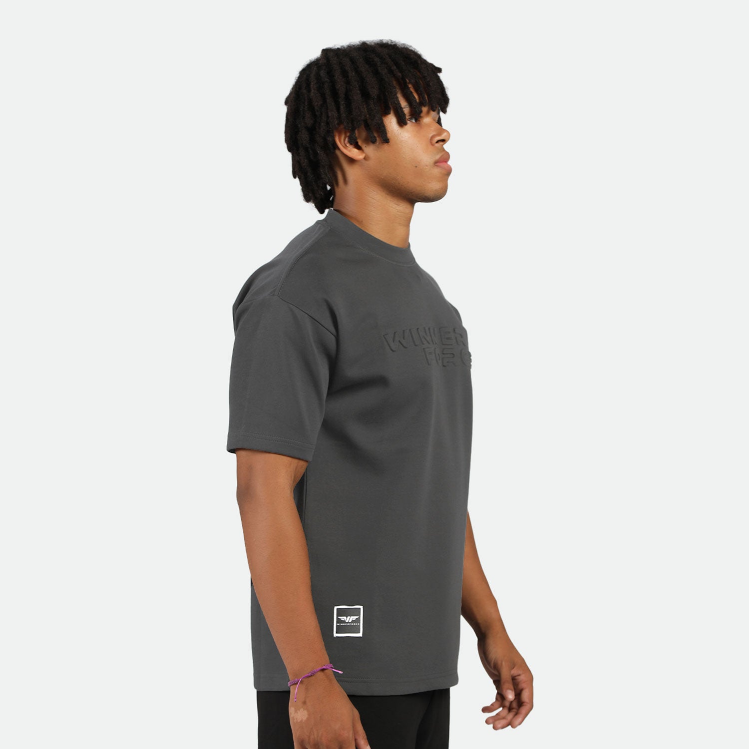 a fit man wearing t-shirt dark grey with short black 