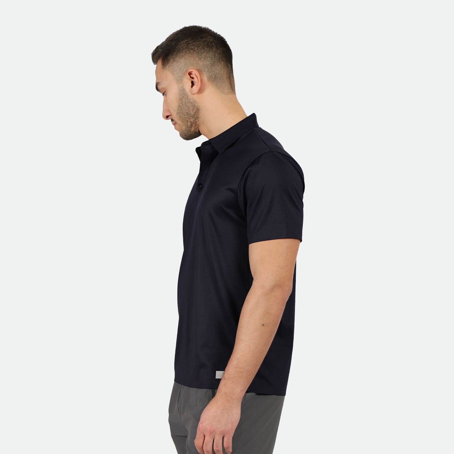 s fit man stand at right and wearing t-shirt polo black with pants grey