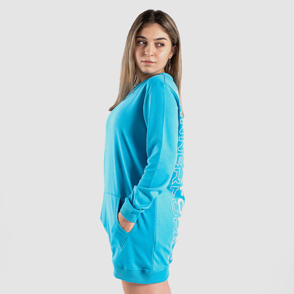 a fit woman stand at right and wearing sweatshirt blue 