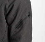 close up view for a person wearing ebony grey tech zipped hoodie with  pocket with zipped 