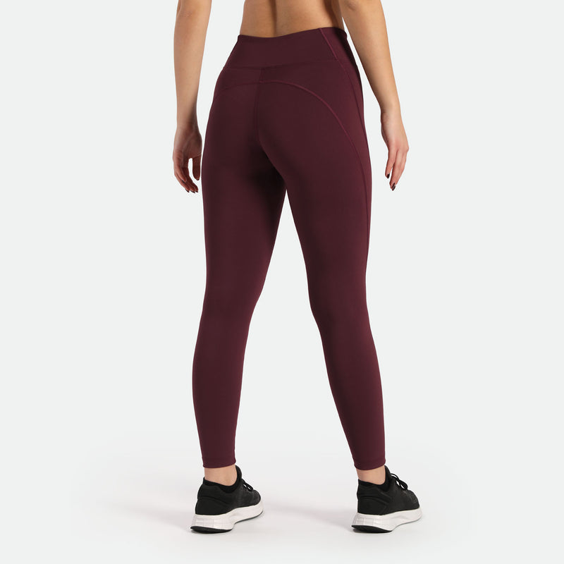  a back view for woman wearing  legging red  and shoes black ,plus background light grey