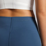 close up view for back view  of woman wearing legging ensign blue 