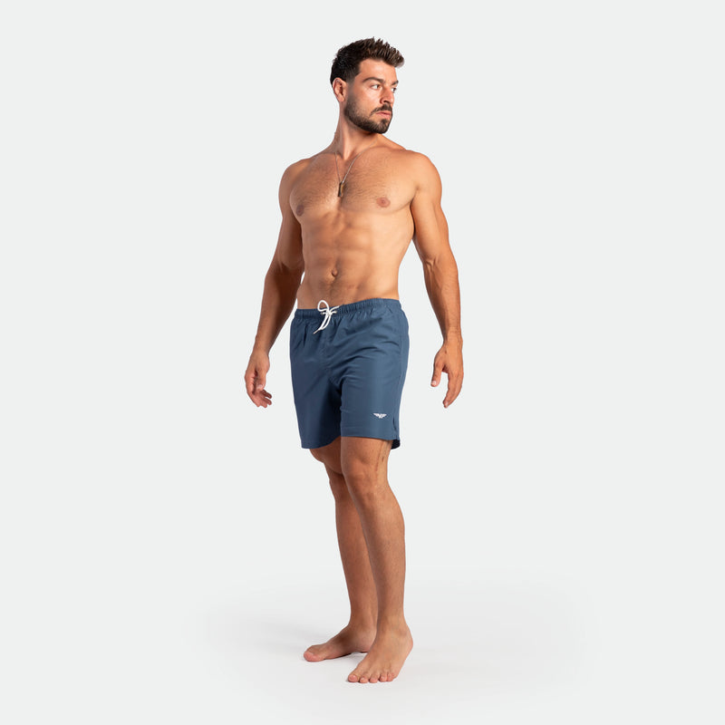 a fit man wearing short ensign blue 