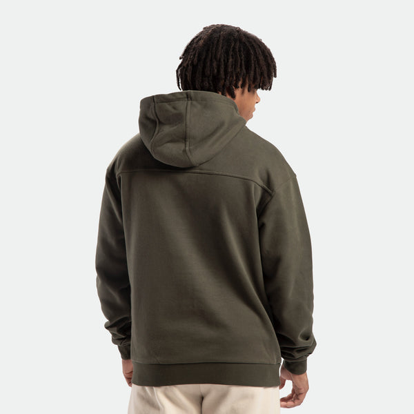 a back view for fit man wearing hoodie forest night green ,and pants beige 