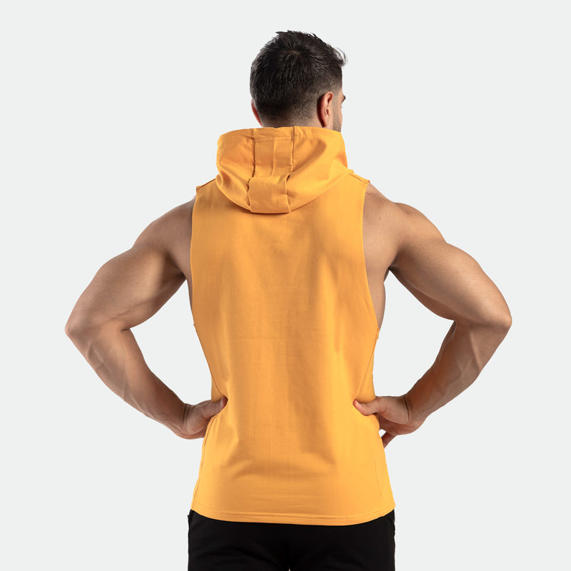 a back vie for person wearing half hoodie golden glow orange with pants black 