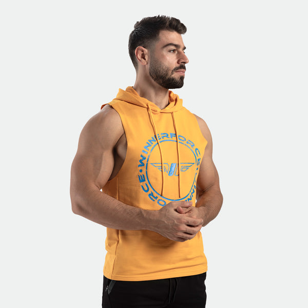 a fit man stand at right and wearing half hoodie golden glow orange with logo ,plus pants black 
