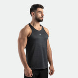 a fit man stand at right and wearing 
 camo tank graphite grey with pants black 