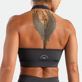 close up view for back view of woman wearing bra graphite grey ,plus the logo 