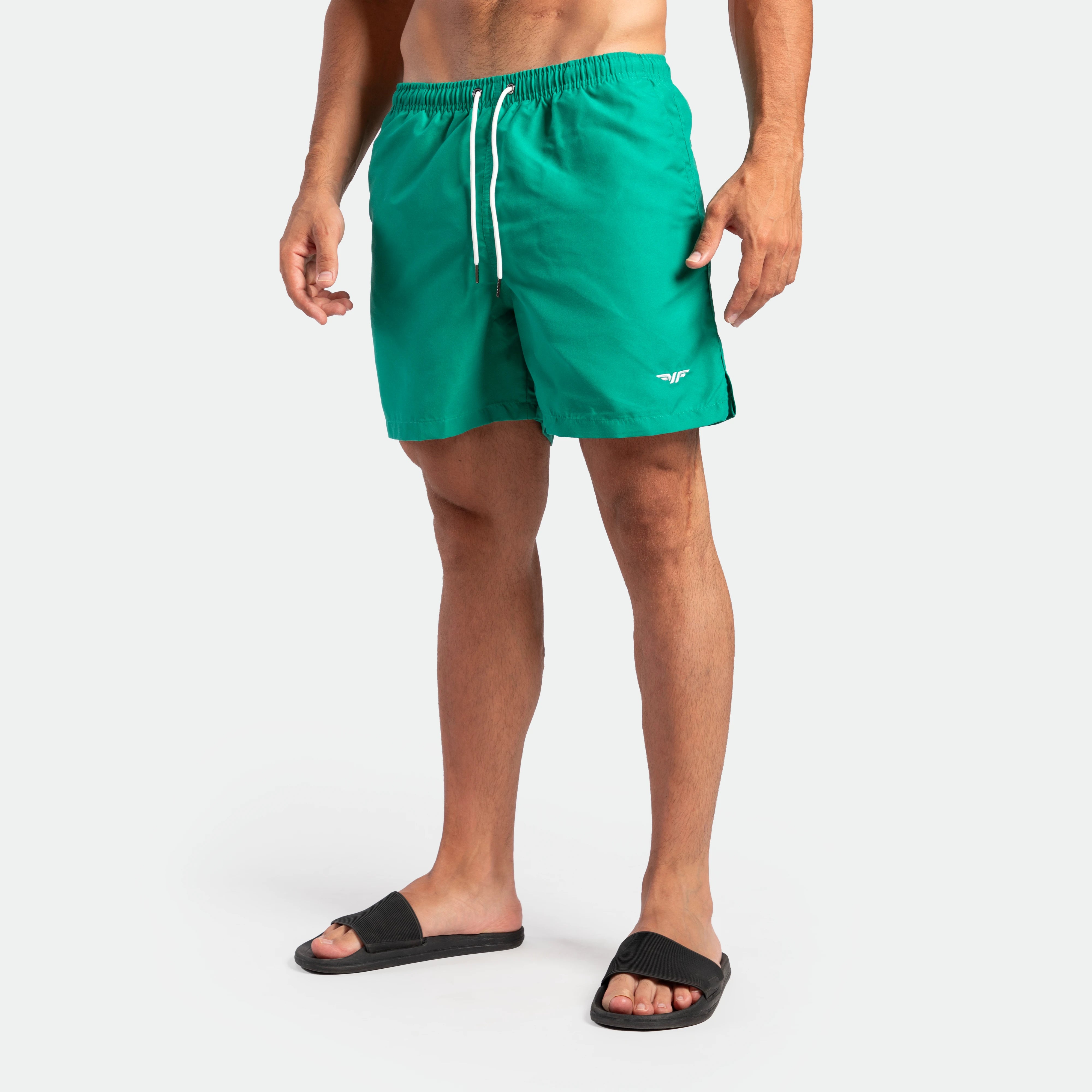 a fit man wearing short green lake 