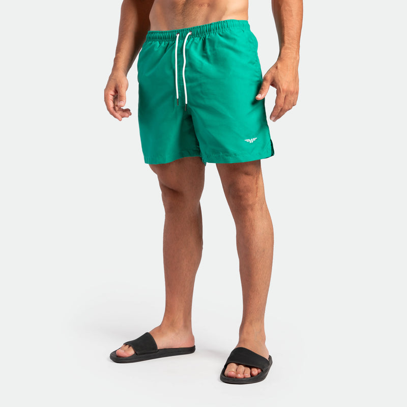 a fit man wearing short green lake 