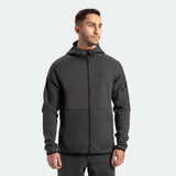 a fit man wearing  matching set grey ebony , tech zipped hoodie and pants 
