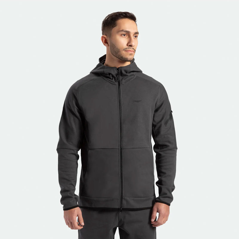 a fit man wearing  matching set grey ebony , tech zipped hoodie and pants 