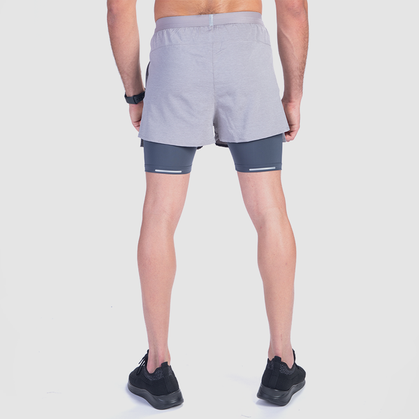 a back view for fit man wearing short grey 2 in 1 with shoes black 