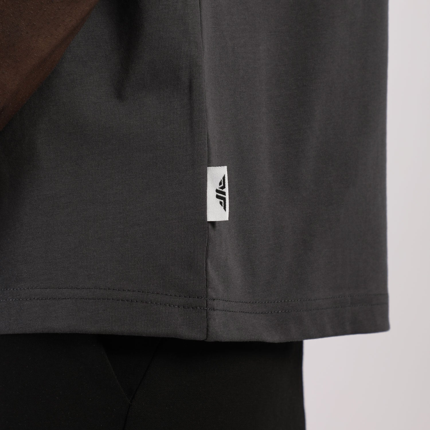 close up view for fit man earing t-shirt dark grey 