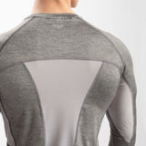 close up view for back view of fit man wearing sleeve t-shirt grey 