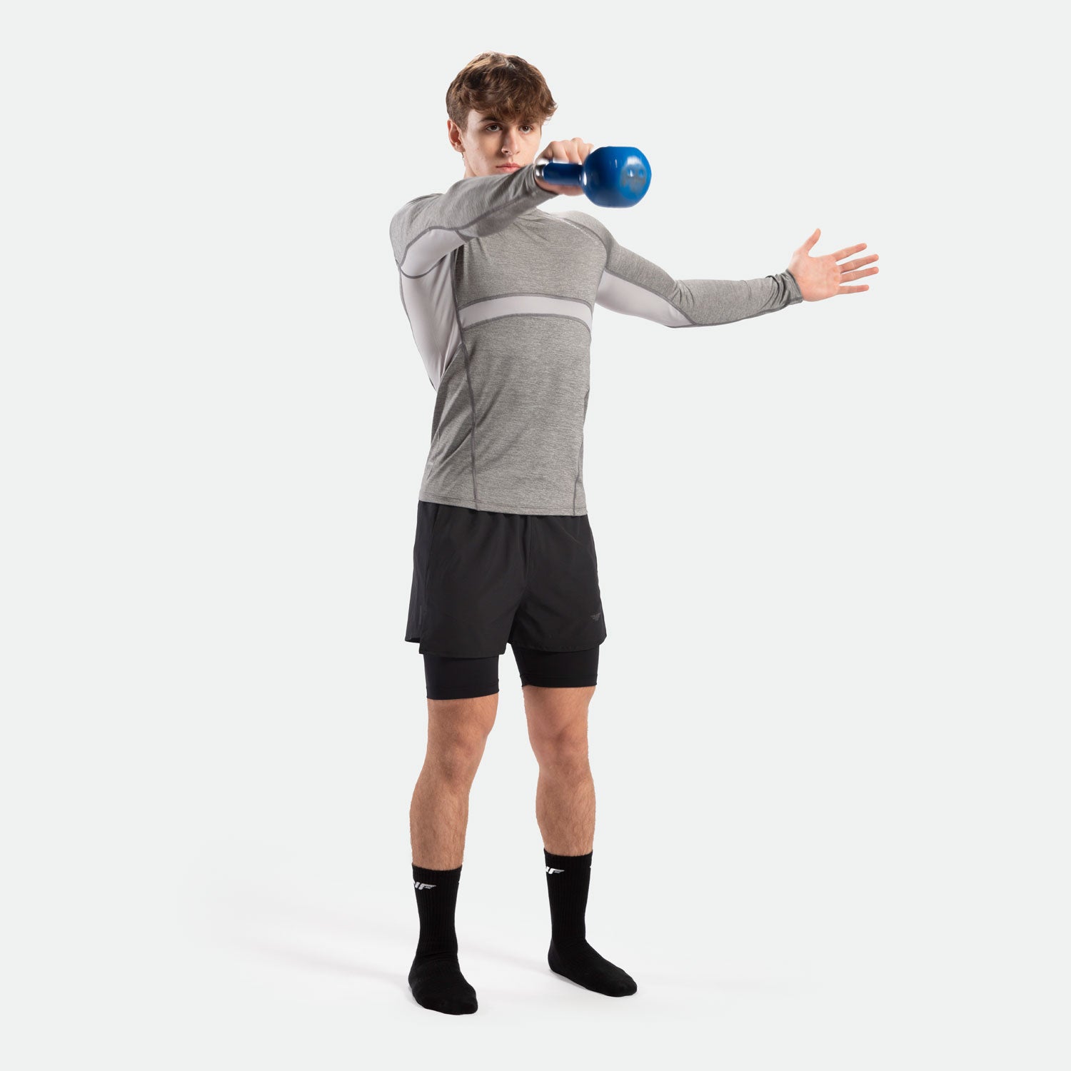 a fit man wearing sleeve t-shirt grey with short 2 in 1 black ,plus socks black 