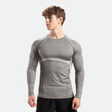 a fit man wearing sleeve t-shirt grey with pants black  
