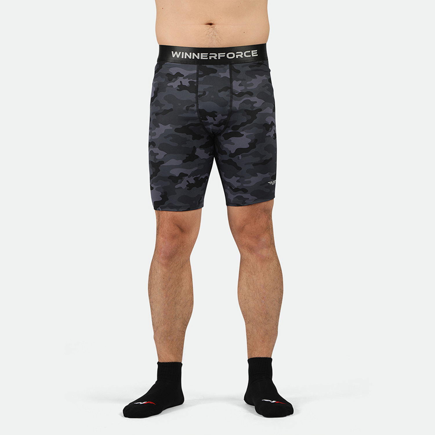 a fit man wearing short  grey toned grey  with socks black 